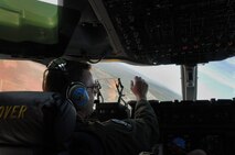 Maj. Ben Lasher, 326th Airlift Squadron, pilots a C-17 Globemaster III through a navigation turn point during a low-level ingress to Keno landing zone during Operation Bunny Flag May 4, 2013, Nellis Air Force Base, Nev. The low-level flying exercise included combat landings, defensive aerial maneuvers and a non-combatant evacuation operation. (U.S. Air Force photo/Senior Airman Erika Brooke) 
