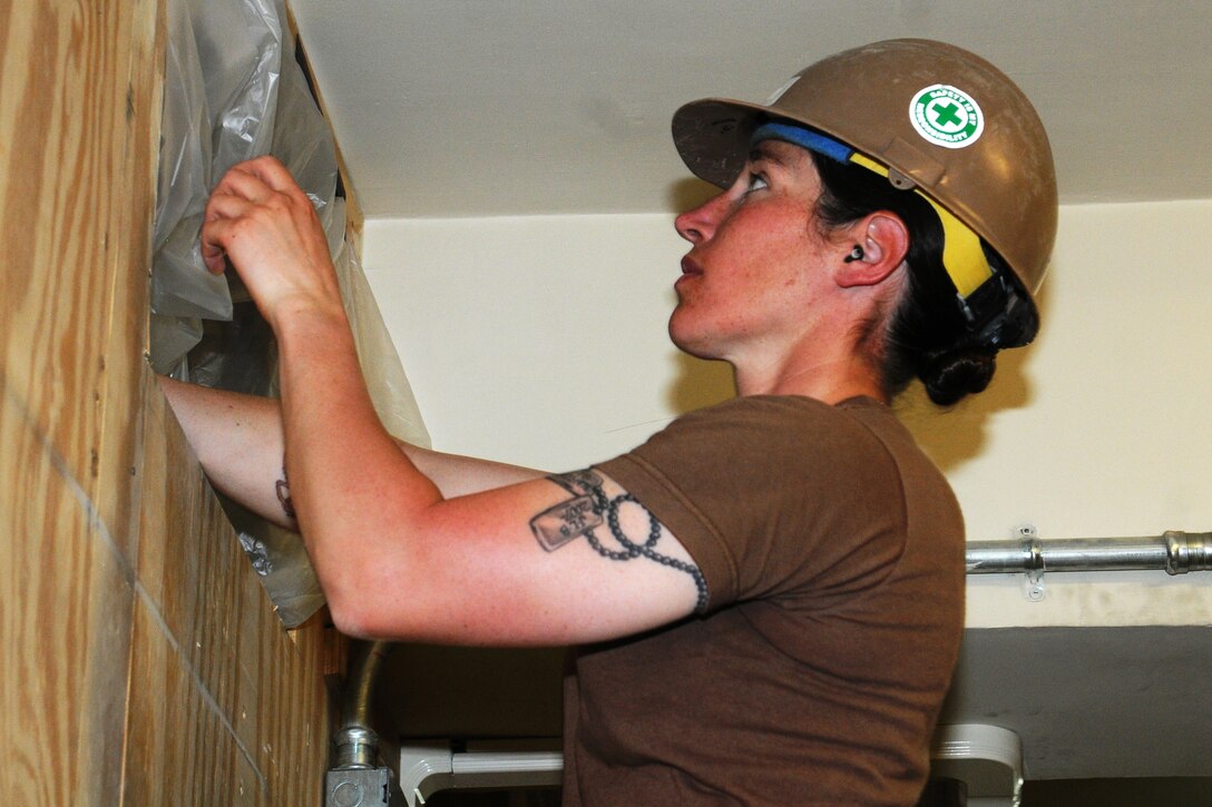 U.S. Navy Petty Officer 1st Class Jennifer Bacon prepares ductwork during a project to support Combined Special Operations Task Force 10 on Camp Phoenix in Kabul, Afghanistan, May 15, 2013. Bacon, a utilitiesman, is assigned to Naval Mobile Construction Battalion 15.