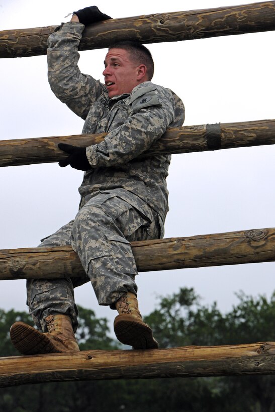 Army Sgt. Andrew French climbs a reverse climb during an obstacle course on Camp Bullis, Texas, May 15, 2013. French is assigned to the 512th Geospatial Engineering Detachment on Fort Sam Houston, Texas.
