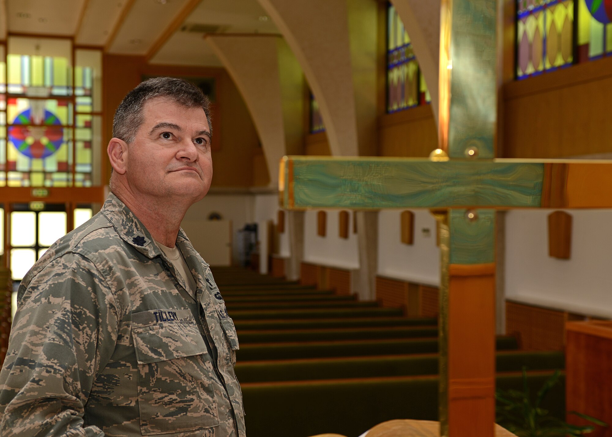 Chaplain (Lt. Col.) John Tillery, reflects on his faith at the Aviano Air Base Chapel in Italy May 15, 2013. Discovering faith helped Tillery recover from a very violent and chaotic upbringing.  (U.S. Air Force photo/Staff Sgt. Ryan Whitney)