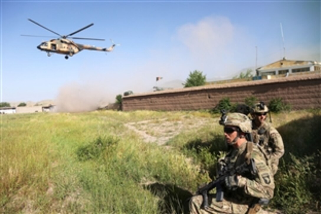 U.S. soldiers secure a landing zone for an Afghan air force Mi-17 helicopter outside of Hesarak village in Nangarhar province, Afghanistan, May 17, 2013. The soldiers are assigned to the 101st Airborne Division's Company A, 1st Battalion, 327th Infantry Regiment, 1st Brigade Combat Team. 