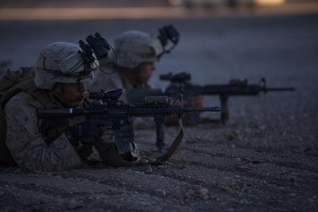 U.S. Marines with Fox Company, 2nd Battalion, 8th Marines (2/8), Regimental Combat Team 7 provide security during a mission rehearsal on Camp Leatherneck, Afghanistan, May 21, 2013. The Marines and Sailors of 2/8 conducted the rehearsal in preparation for a partnered operation with their Afghan National Army counterparts. (U.S. Marine Corps photo by Kowshon Ye/Released)