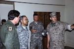 Maj. Gen. Charles Rodriguez, second from left, the adjutant general of Texas, said Friday that the Texas National Guard would resume relief missions as soon as possible in the wake Hurricane Ike.