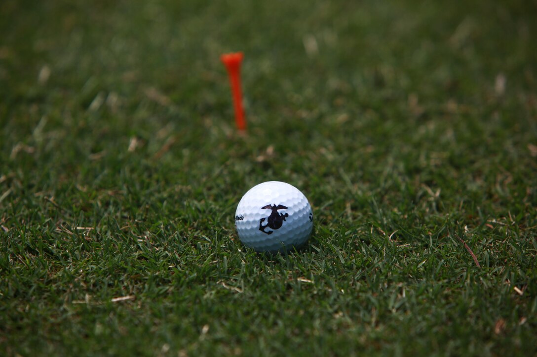 A golf ball sits next to a tee on the Cherry Point Sound of Freedom Golf Course.