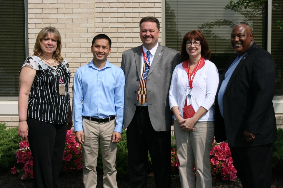 Marine Corps Systems Command and Program Executive Officer Land Systems have won the 2012 Department of the Navy Acquisition Excellence Award for Small Business Team. Led by Dave Dawson (center), associate director of Small Business Programs, team members included (from left) Jodie Shifflett, contracting officer; Dung "Zoom" Phan, lead engineer; Judy Campbell, contract specialist; and Austin "A.J." Johnson, Small Business Program deputy. Not pictured are Patrick Garrard, program analyst, and Lenore Boissiere, project officer. 
