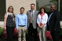 Marine Corps Systems Command and Program Executive Officer Land Systems have won the 2012 Department of the Navy Acquisition Excellence Award for Small Business Team. Led by Dave Dawson (center), associate director of Small Business Programs, team members included (from left) Jodie Shifflett, contracting officer; Dung "Zoom" Phan, lead engineer; Judy Campbell, contract specialist; and Austin "A.J." Johnson, Small Business Program deputy. Not pictured are Patrick Garrard, program analyst, and Lenore Boissiere, project officer. 