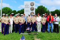 Marines of the 9th Marine Corps District and members of the Simpson Hoggat Marine Corps League detachment pose for a photo after placing dozens of American flags on the graves of passed veterans at Mount Moriah South Cemetery, May 23.