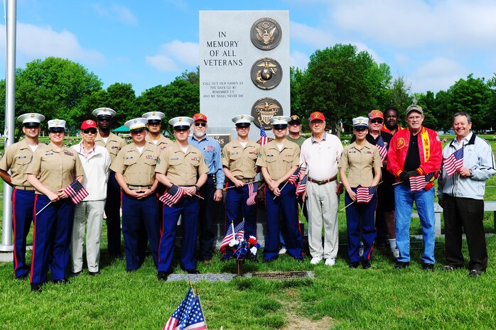 Marines of the 9th Marine Corps District and members of the Simpson Hoggat Marine Corps League detachment pose for a photo after placing dozens of American flags on the graves of passed veterans at Mount Moriah South Cemetery, May 23.