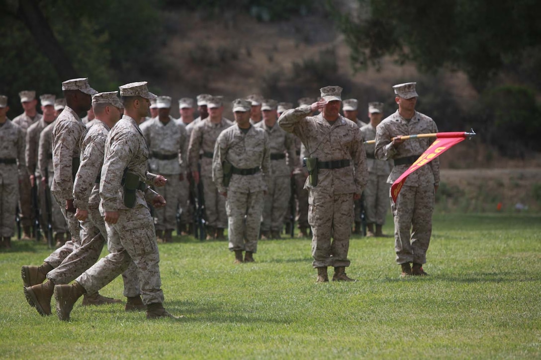 Lt. Col. Ahmed T. Williamson and Lt. Col. Matthew R. Simmons walk a ceremonial lap addressing Marines from 9th Communications Battalion, I Marine Expeditionary Force Headquarters Group, at the change of command ceremony at Camp Pendleton, Calif., May 23. Lt. Col. Matthew R. Simmons relieved Lt. Col. Ahmed T. Williamson as the commanding officer of 9th Comm. Bn., I MHG.