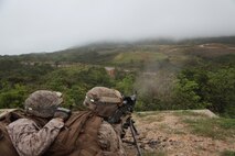 Lance Cpls. Bennett M. Russ, right, and Robert T. Davis, fire an M240B medium machine gun during a field training exercise May 15 at the Range 10 complex at Camp Schwab. During the exercise, the company conducted live-fire training, improvised explosive device detection training, convoy movements and forward operating base demilitarization to prepare for an upcoming deployment to Afghanistan. Russ is a combat engineer with Company F, 9th Engineer Support Battalion, 3rd Marine Logistics Group, III Marine Expeditionary Force. Davis is a motor transport operator with the company. 