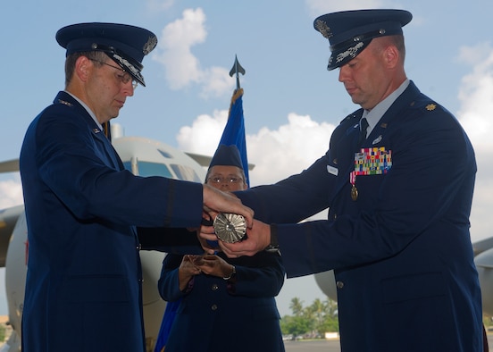 Col. Michael J. Novotny, 15th Maintenance Group commander (left), and Maj. Mark A. Rardin, 15th Maintenance Operations Squadron commander, case the 15th MOS guidon during an inactivation ceremony, at Joint Base Pearl Harbor-Hickam, Hawaii, May 23, 2013. (U.S. Air Force photo Tech. Sgt. Jerome S. Tayborn)