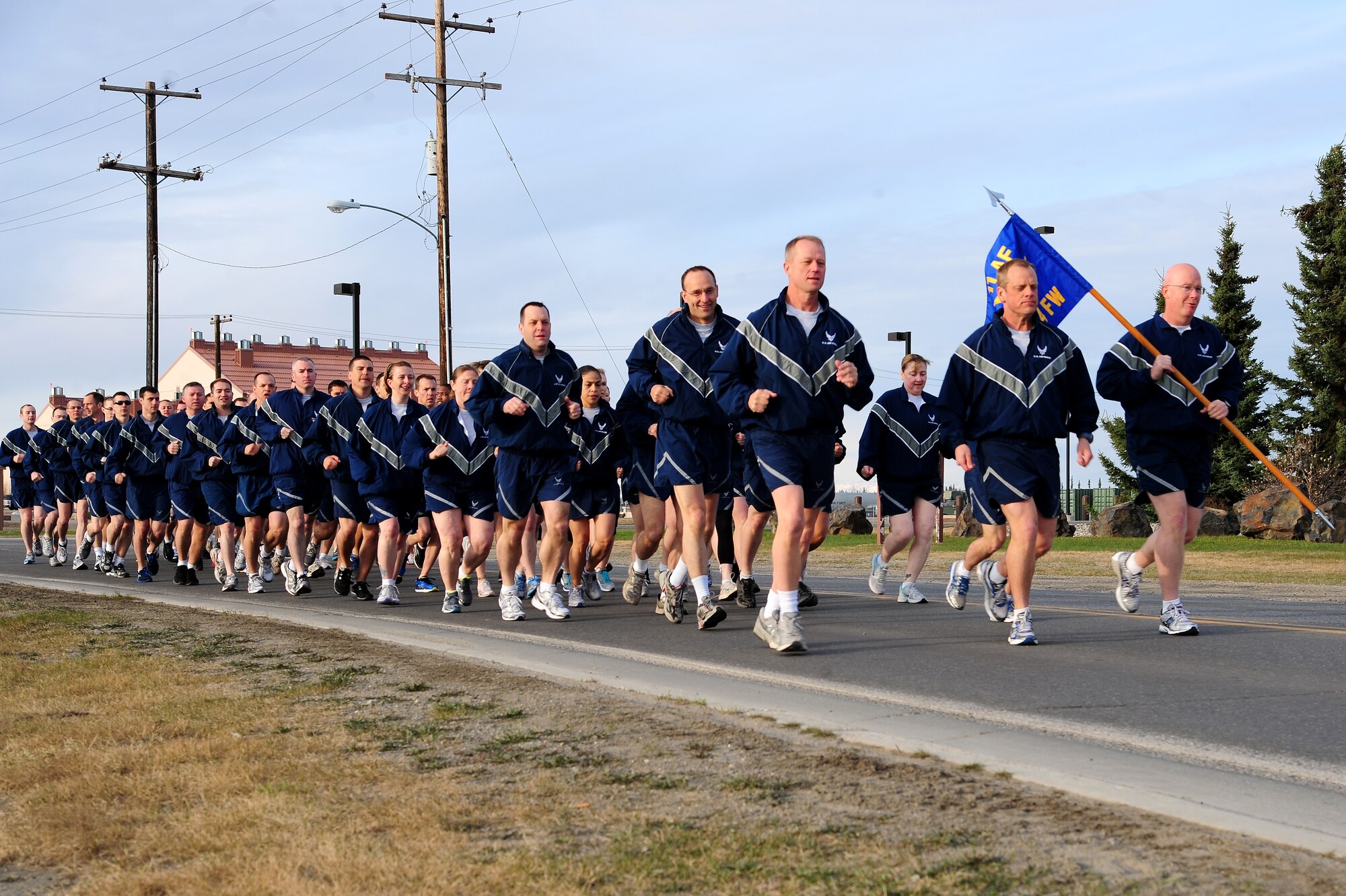 354th Fighter Wing Airmen run during a Memorial Day wing run May 23, 2013, Eielson Air Force Base, Alaska. The run included a reveille ceremony and remarks by Brig. Gen. Mark Kelly, 354th fighter Wing commander. (U.S. Air Force photo by Senior Airman Zachary Perras/Released)