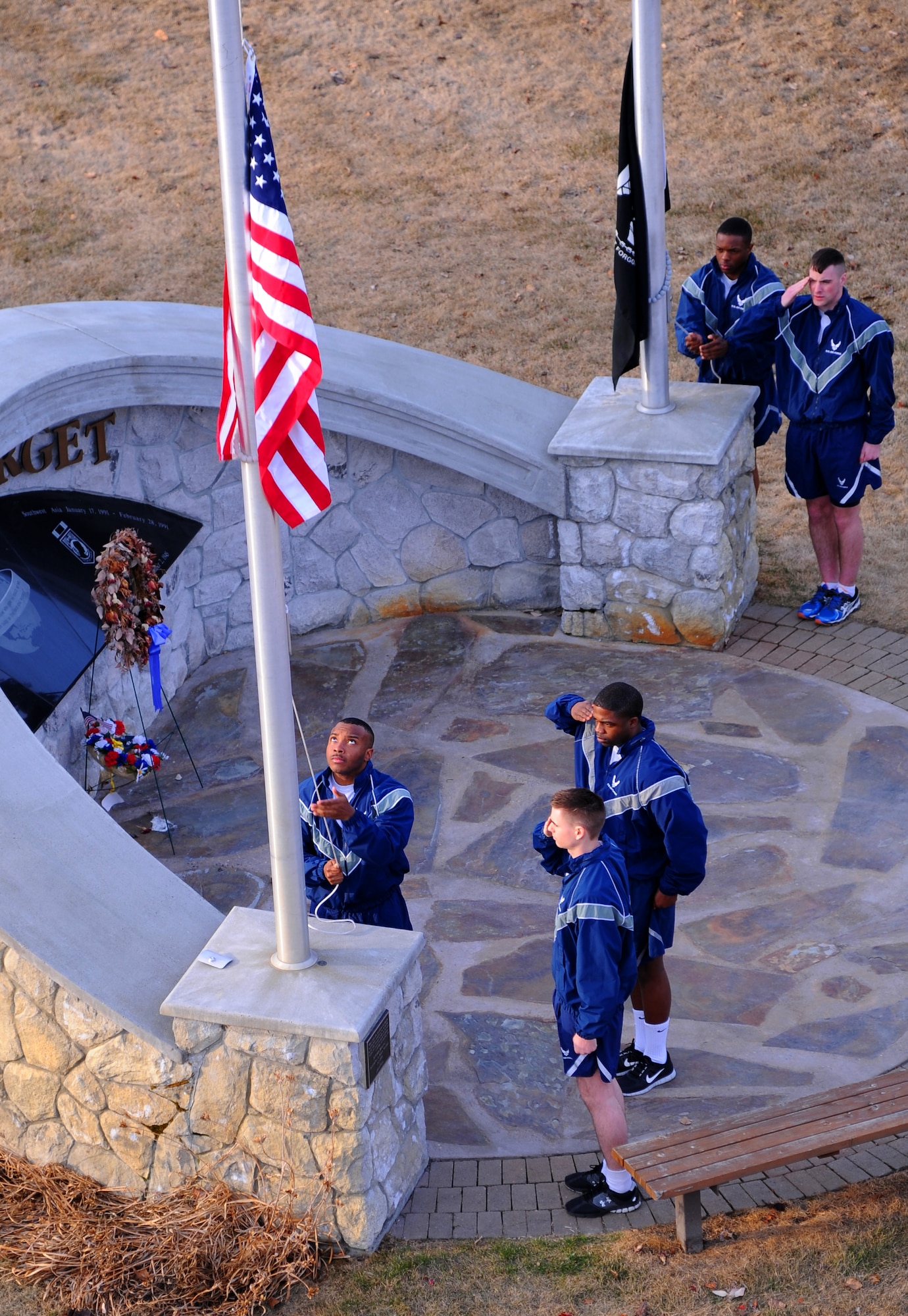 Airman 1st Class Travon Dowell, 354th Mission Support Group knowledge operator, raises the American Flag during a Memorial Day reveille ceremony May 23, 2013, Eielson Air Force Base, Alaska. The ceremony kicked off a wingman day for the Icemen team, building on resilience and camaraderie. (U.S. Air Force photo by Senior Airman Racheal E. Watson/Released)