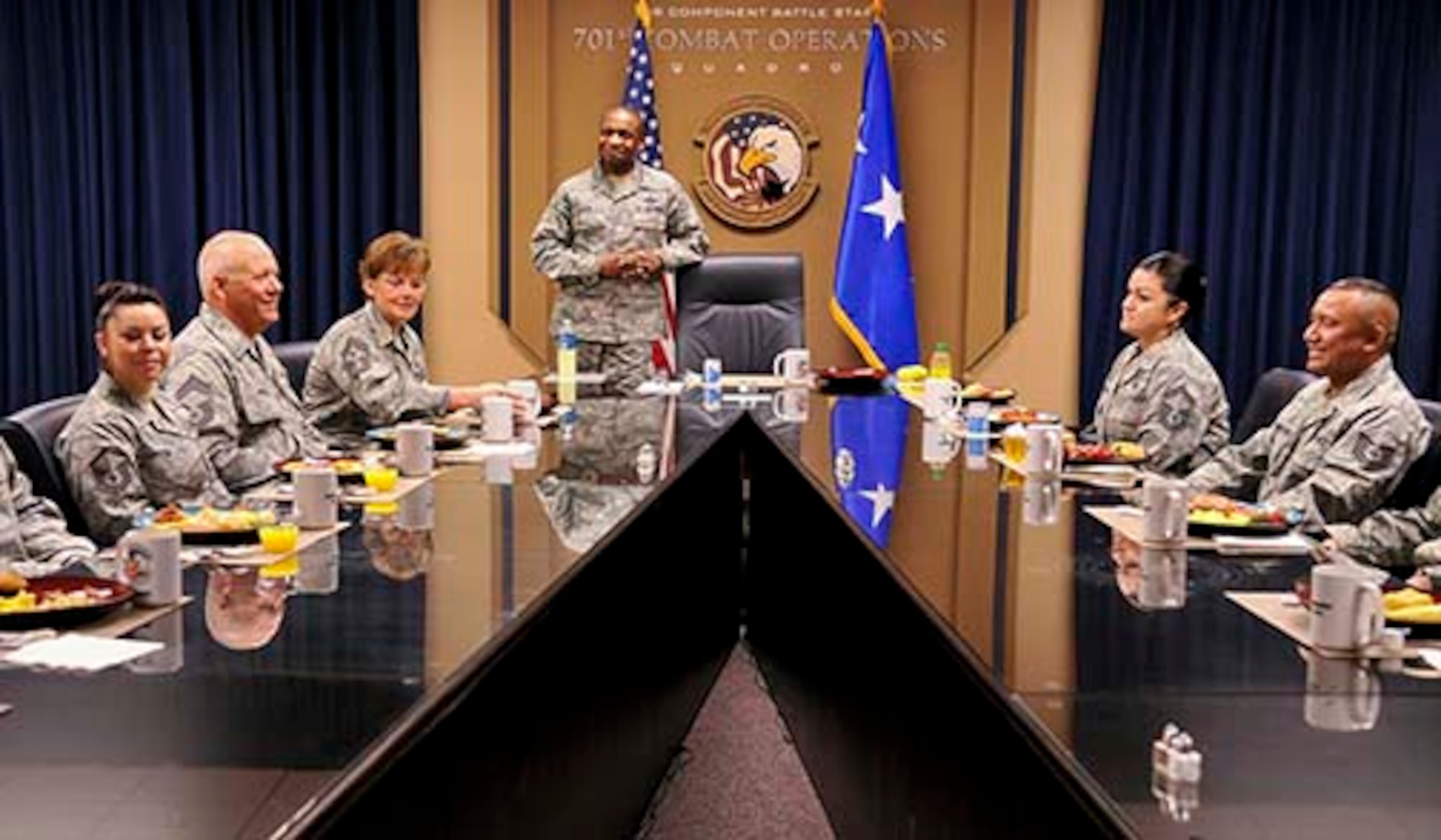 Lt. Gen. Darren McDew, commander, 18th Air Force and Chief Master Sgt. Vicki
Gamble, command chief, 18th Air Force, to his right, meet with March Air
Reserve Base Airmen May 9, to thank them for their service and congratulate
them on the jobs they are doing to support the Air Mobility Command mission.
The numbered Air Force visit was a result of the outstanding efforts of Team
March in support of Superstorm Sandy relief efforts. (U.S. Air Force
photo/Staff Sgt. Jacquelyn Estrada)
