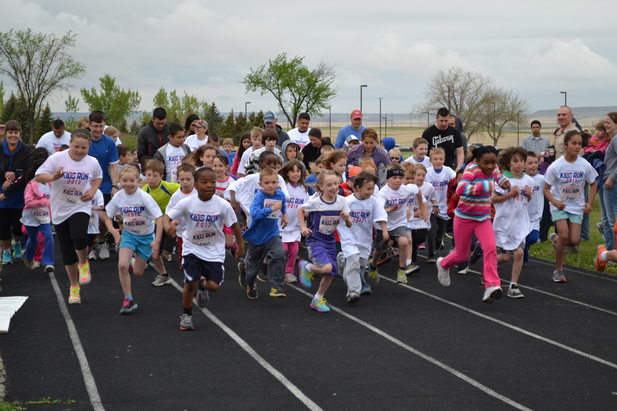 Children of all ages start the Armed Forces Kids’ Run on the Malmstrom Fitness Center track on May 18.  More than 110 children of all ages participated in the event.  (U.S. Air Force photo/Senior Airman Cortney Paxton)
