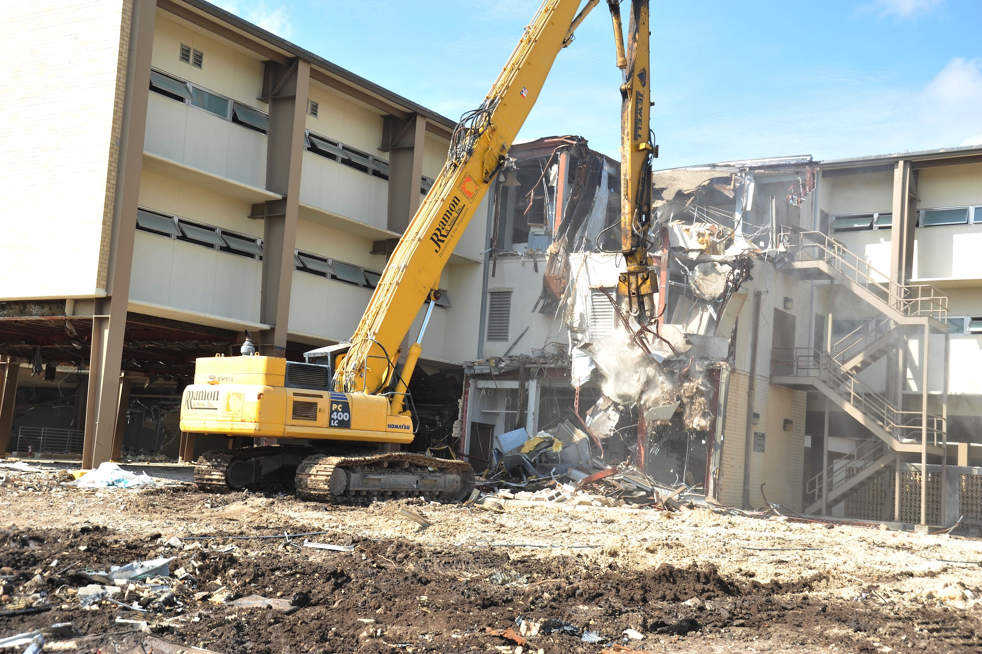 Formerly the home to the 323rd Training Squadron, Building 6275 stood for decades and served as the first Air Force home to Basic Trainees. The 323rd was the first squadron to move into the new Airman Training Complex and building 6275 was scheduled for demolition. The first walls came down in early May of 2013. (U.S. Air Force Photo/Alan Boedeker)