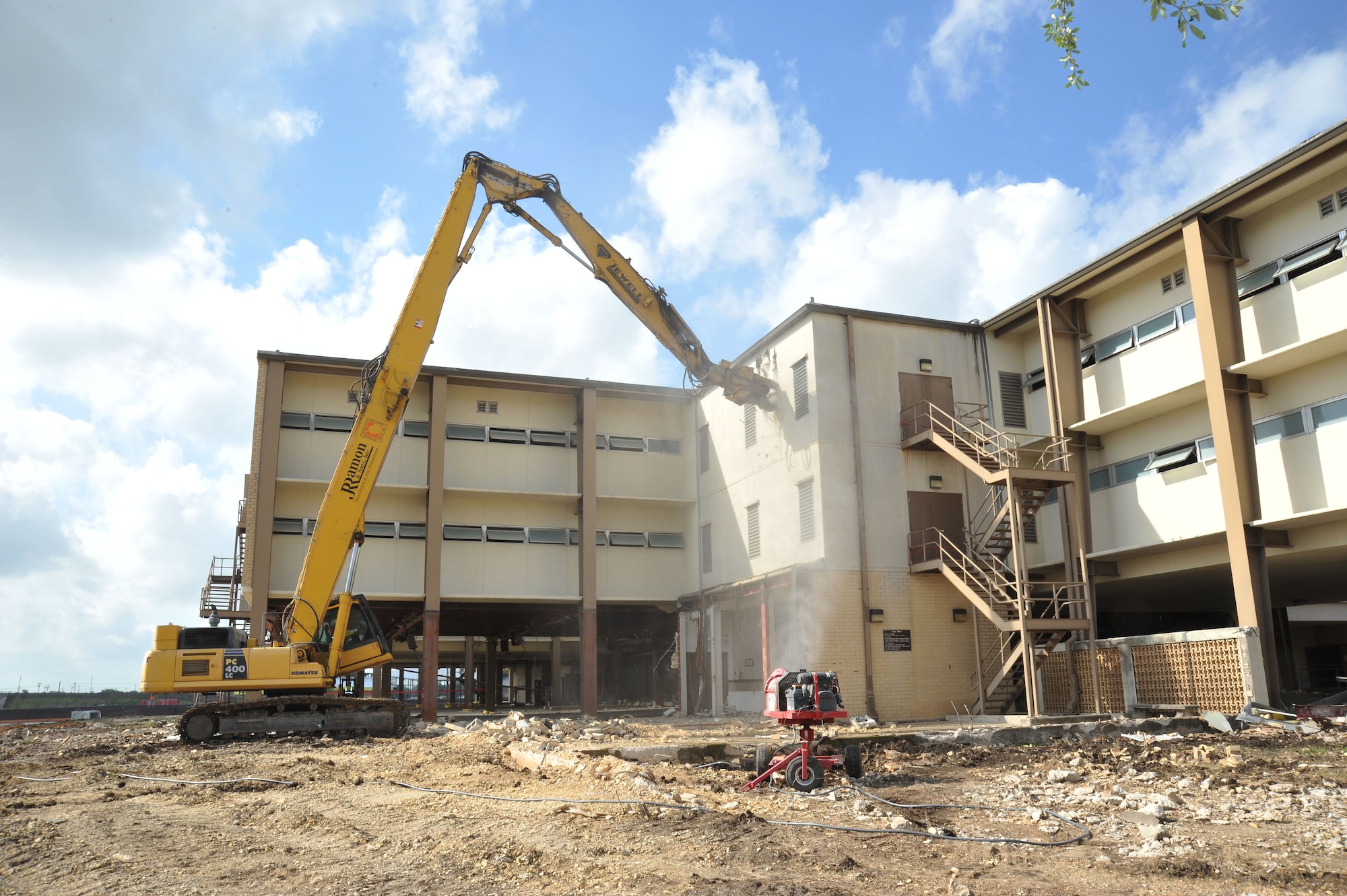 Formerly the home to the 323rd Training Squadron, Building 6275 stood for decades and served as the first Air Force home to Basic Trainees. The 323rd was the first squadron to move into the new Airman Training Complex and building 6275 was scheduled for demolition. The first walls came down in early May of 2013. (U.S. Air Force Photo/Alan Boedeker)