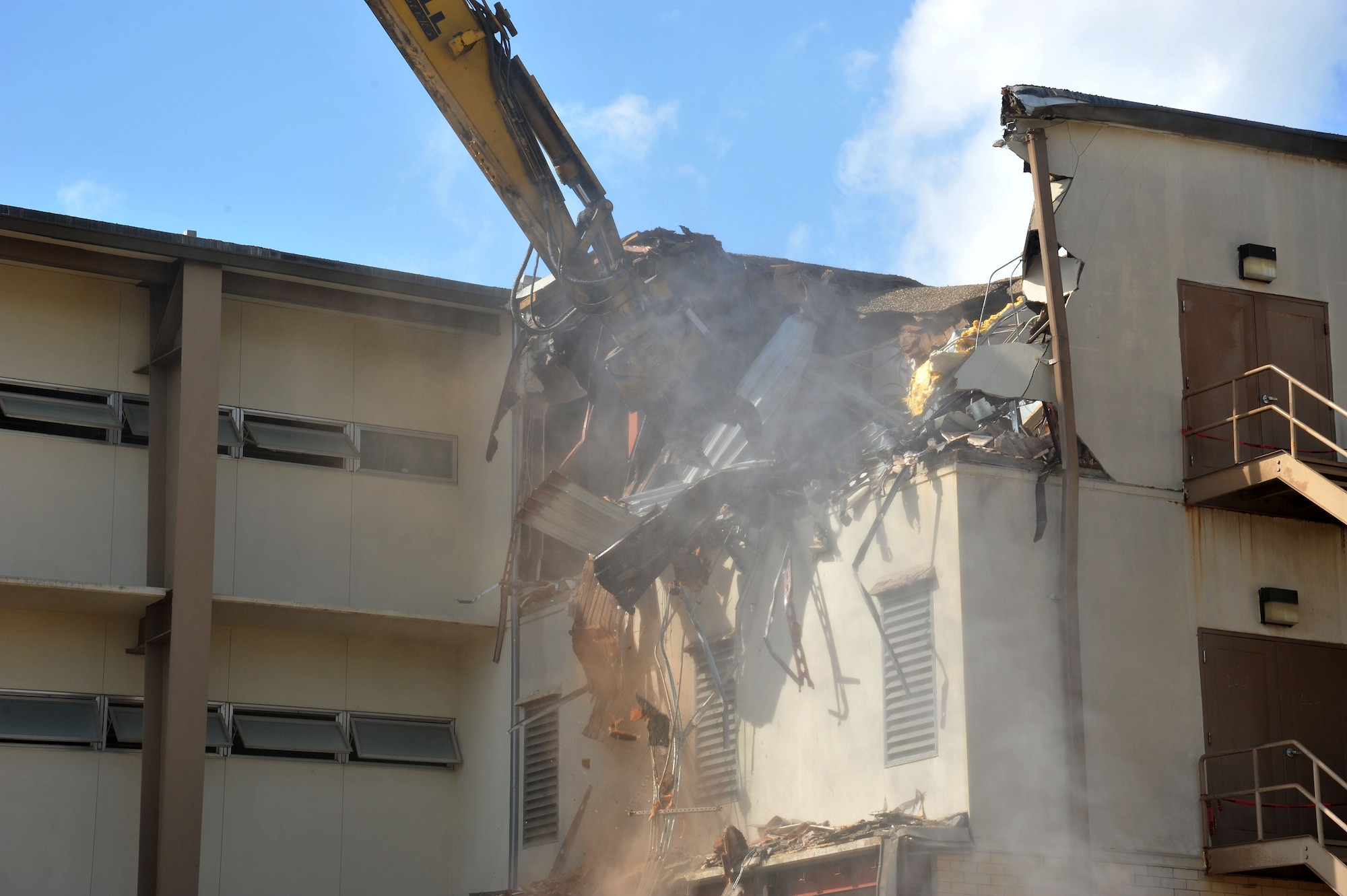 Formerly the home to the 323rd Training Squadron, Building 6275 stood for decades and served as the first Air Force home to Basic Trainees. The 323rd was the first squadron to move into the new Airman Training Complex and building 6275 was scheduled for demolition. The first walls came down in early May of 2013. (U.S. Air Force Photo/Alan Boedeker)