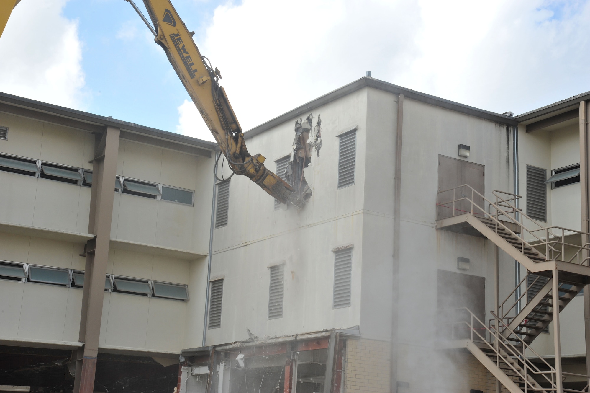 Formerly the home to the 323rd Training Squadron, Building 6275 stood for decades and served as the first Air Force home to Basic Trainees. The 323rd was the first squadron to move into the new Airman Training Complex and building 6275 was scheduled for demolition. The first walls came down in early May of 2013. (U.S. Air Force Photo/Alan Boedeker)