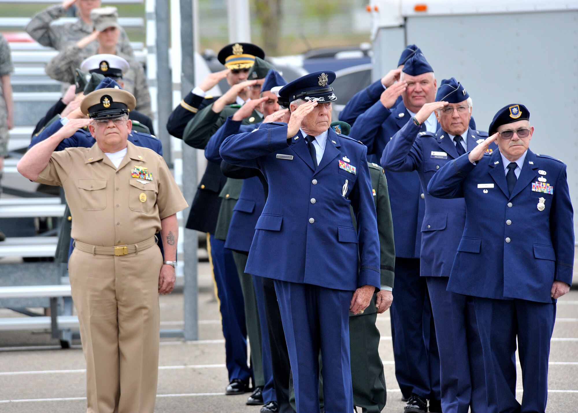 Both retired members of all services and active-duty Airmen, background, participate in the formal retreat ceremony for the annual Retiree Appreciation Weekend May 18. The ceremony was held at the Medal of Honor Park in honor of military veterans in Montana. (U.S. Air Force photo/John Turner)