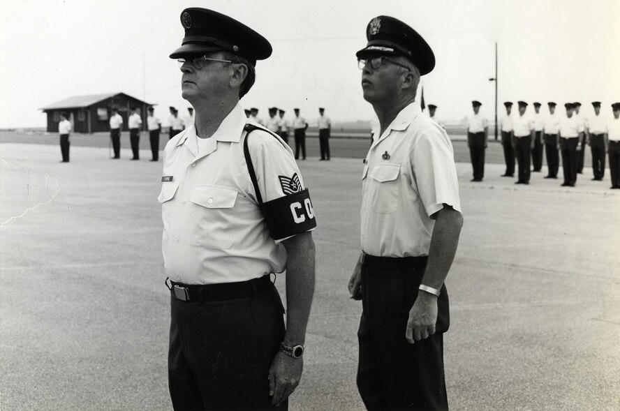 MCGHEE TYSON AIR NATIONAL GUARD BASE, Tenn. – A U.S. Air National Guard student at Noncommissioned Officer Academy class 79-C is inspected by Col. Edmund C. Morrisey at the I.G. Brown Training and Education Center here on the parade ground. Morrisey was commandant of the first NCOA class and the center's first commander, 1968-1983. In July 1968, the TEC's first faculty and students started the Air Guard's six-week academy in the corner of an hanger. (U.S. Air National Guard file-photo/Released)