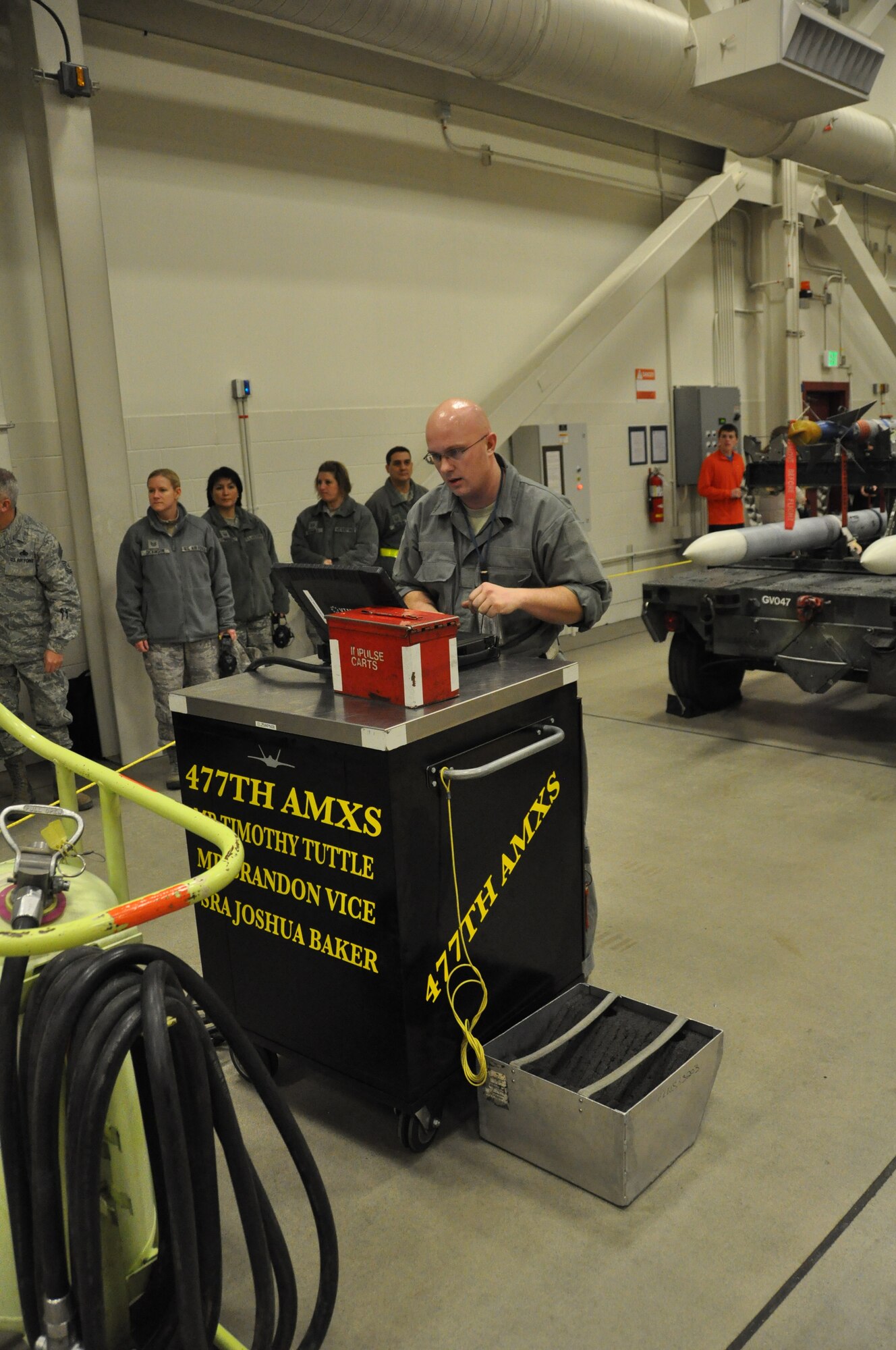 Tech. Sgt. Timothy Tuttle, 477th AMXS, reviews the aircraft forms and tech
data after his crew successfully loaded an F-22 during the annual Weapons
Load Competition here. His crew was selected as the 2012 JBER F-22 Weapons
Load Crew of the Year.(U.S. Air Force/ Tech. Sgt. Dana Rosso)
