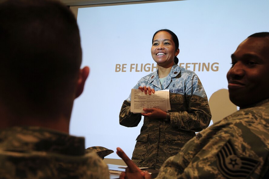 Maj. Elisa Hammer, 779th Aeromedical Squadron Bioenvironmental Engineering flight chief, conducts a flight meeting May 3, 2013, at Joint Base Andrews, Md. ?There is never a dull moment in bioenvironmental engineering and it is an honor to serve alongside these bright Airmen,? Hammer said. (U.S. Air Force photo by Senior Airman Steele C. G. Britton)