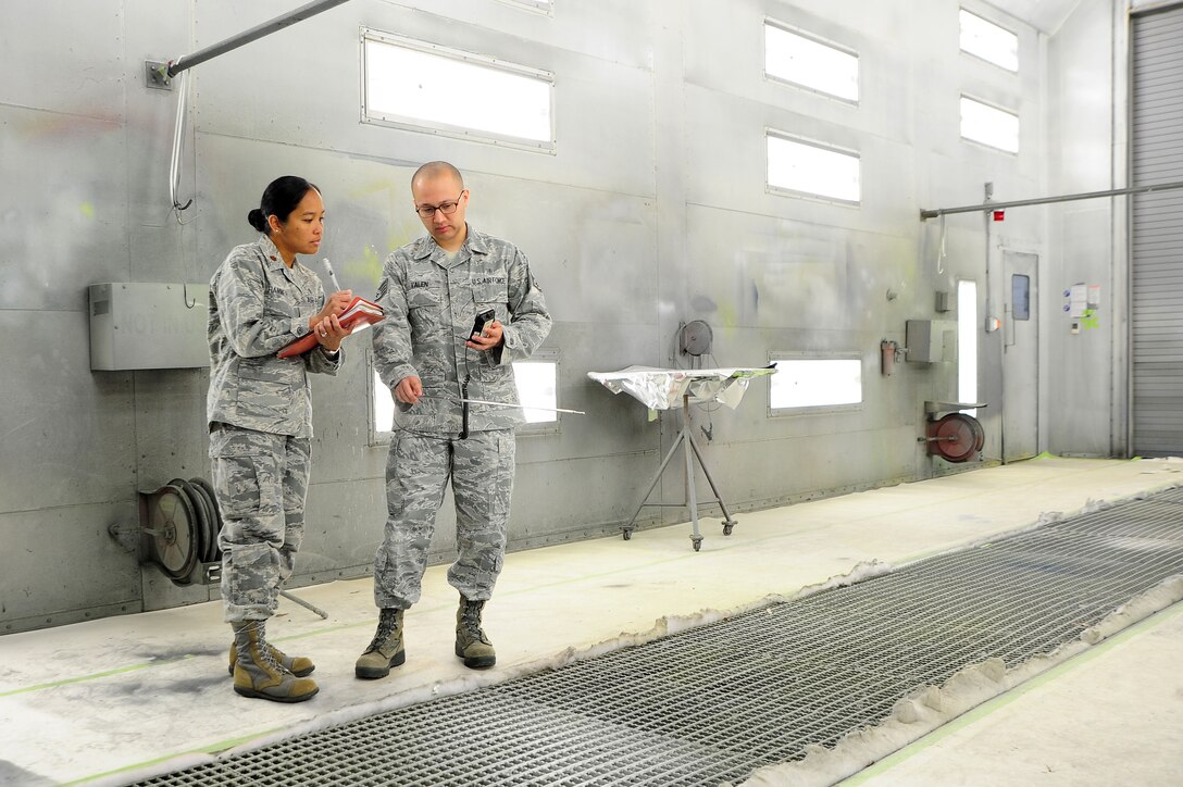 Maj. Elisa Hammer, 779th Aeromedical Squadron Bioenvironmental Engineering Flight chief, and Staff Sgt. Emanuel Valen, 779th AMDS bioenvironmental engineering technician, test air ventilation in an aircraft paint booth, May 2, 2013, at Joint Base Andrews, Md. Outside of the industrial workplace, the bioenvironmental Airmen also ensure safe drinking water to the base community. (U.S. Air Force photo by Senior Airman Steele C. G. Britton)