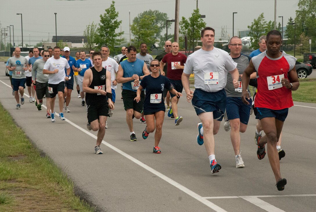 Servicemembers and civilians start the 5k run during "Fitness Under the Big Top", here at the Niagara Falls Air Reserve Station. Since 1983, the month of May has been observed as National Physical Fitness Month.  In keeping with that tradition, Niagara hosted a “Fitness Under the Big Top” to serve as a way to get members on the installation out of their normal routines and engage in physical fitness for part of the day. (U.S. Air Force photo by Tech Sgt. Andrew Caya)