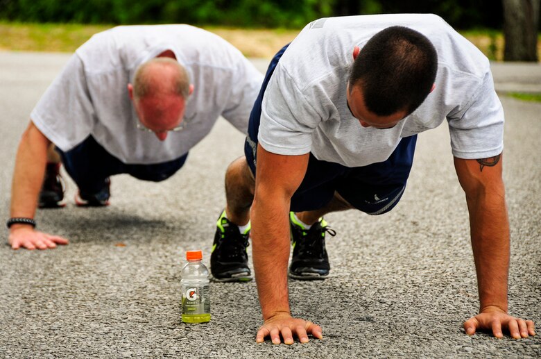 Airmen complete the push-up station during the May 5k Fun Run at Duke Field, Fla.  Almost 50 Airmen ran for the the 5k May 5.  (U.S. Air Force photo/Tech. Sgt. Jon McCallum)