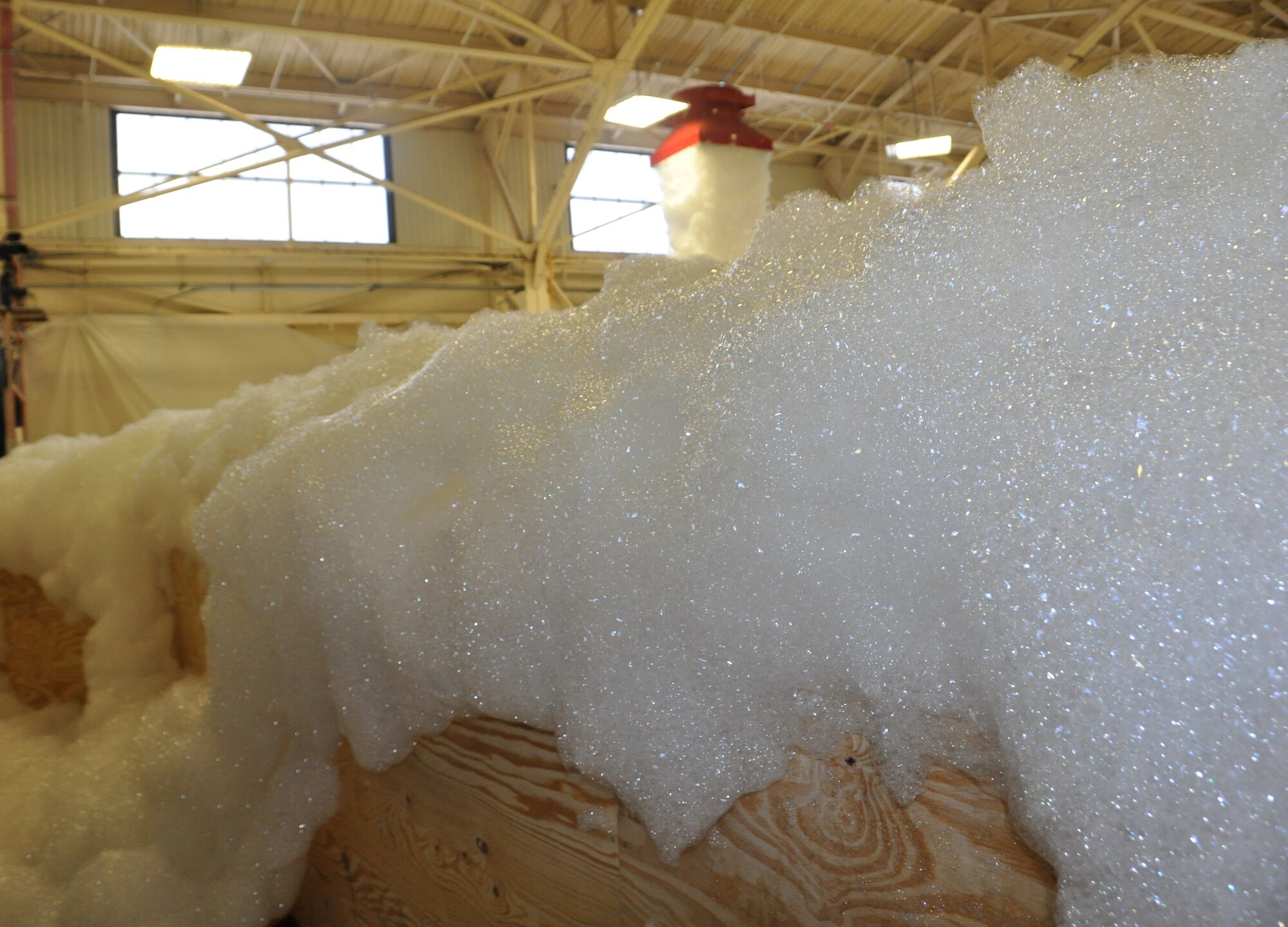 The 325th Civil Engineer Squadron tested the high expansion foam fire supression system in Hangar 2 as part of the final steps in the renovation process May 22. Six feet of expanded foam filled the hangar in less than two minutes.(U.S. Air Force photo by 2nd Lt. Andrea Valencia)