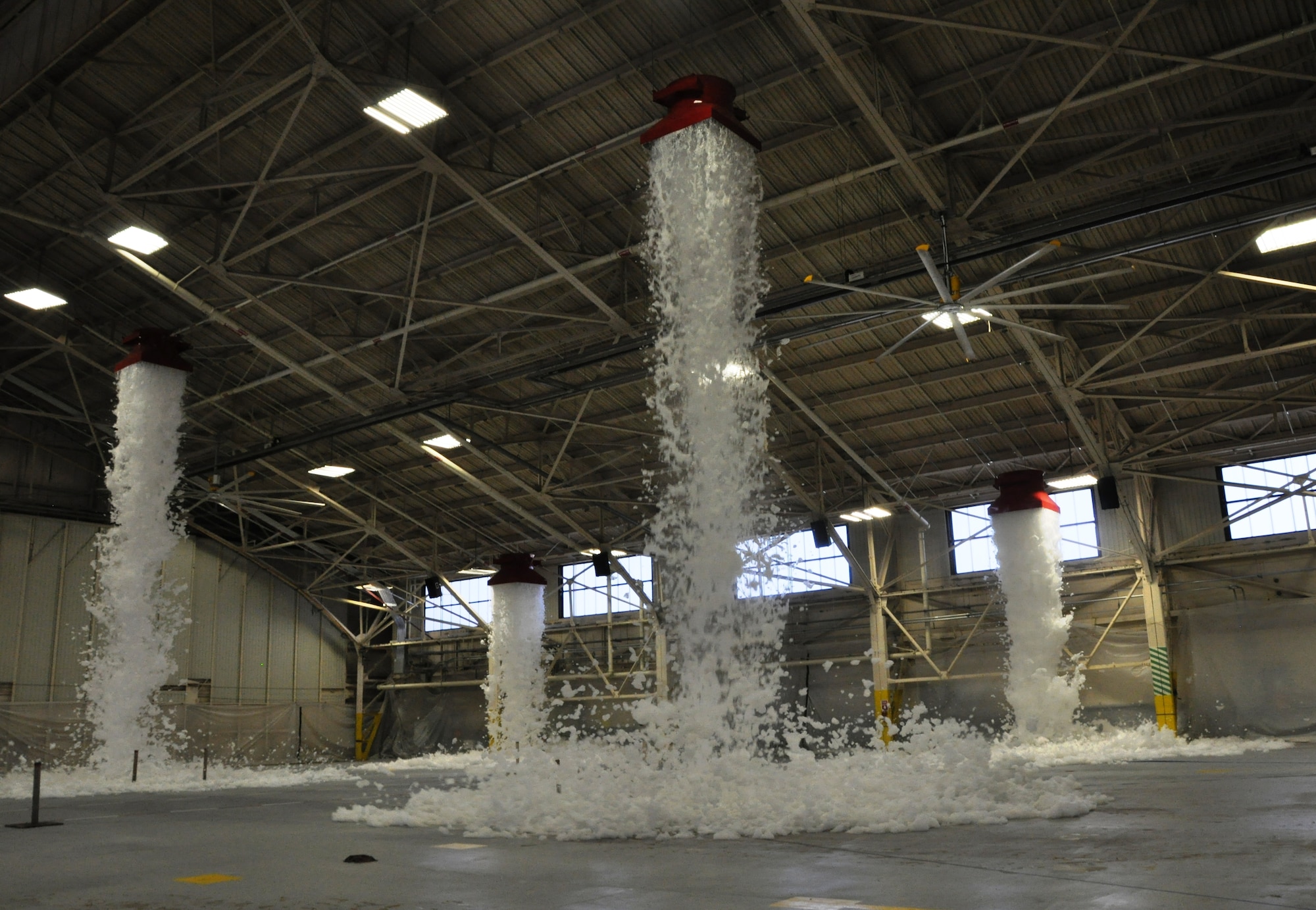 The 325th Civil Engineer Squadron tested the high expansion foam fire supression system in Hangar 2 as part of the final steps in the renovation process May 22. The expanded foam extinguishes fires by forming a blanket, which cuts off the air to the flames.(U.S. Air Force photo by 2nd Lt. Andrea Valencia)