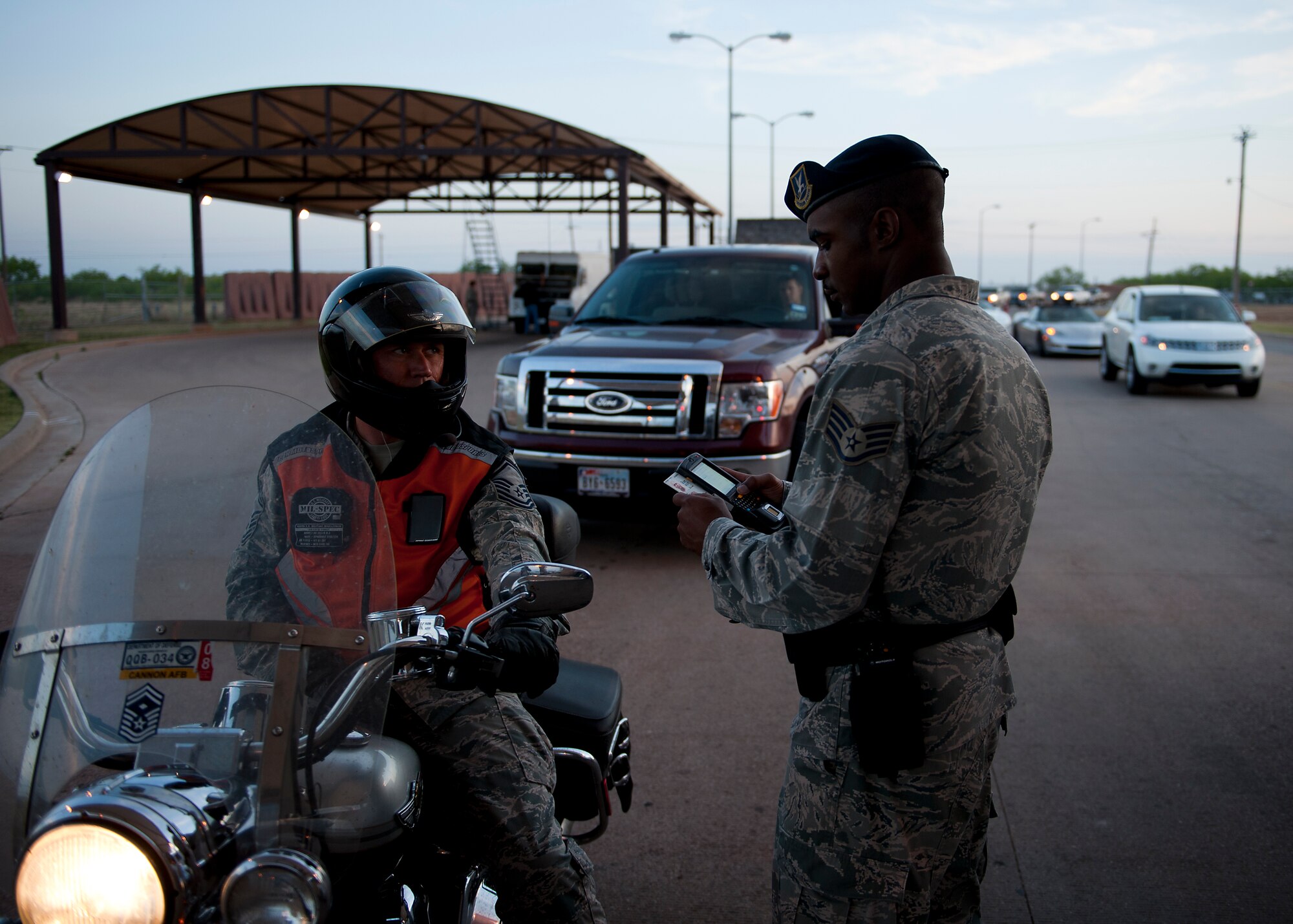 U.S. Air Force Staff Sgt. Antinain Knight, 7th Security Forces Squadron (SFS), runs a common access card through the Defense Biometric Identification System May 9, 2013, at Dyess Air Force Base, Texas. More than 4,000 vehicles pass through the gates of Dyess on any given day. Each vehicle and person inside is checked by the 7th SFS for proper identification before being allowed to entry to the base. The 7th SFS is entrusted with protecting the people, property and resources of Dyess.  (U.S. Air Force photo by Airman 1st Class Damon Kasberg/Released)