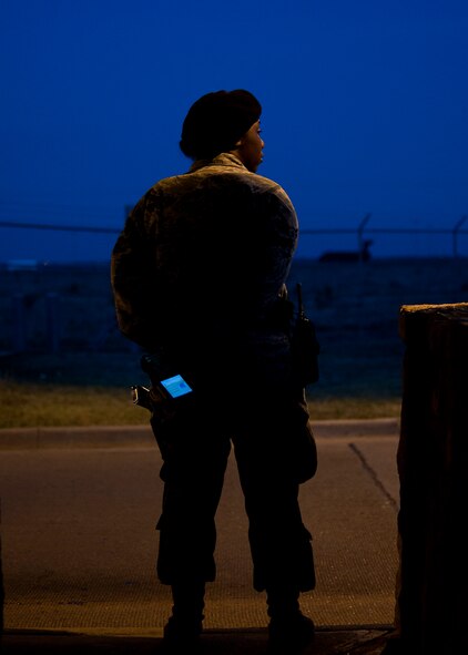 U.S. Air Force Airman 1st Class Tonish Williams, 7th Security Forces Squadron (SFS), guards the Tye Gate May 9, 2013, at Dyess Air Force Base, Texas. The 7th SFS is entrusted with protecting the people, property and resources of Dyess. They conduct law enforcement and force protection for a population of 8,500 on a 7,016 acre base. The squadron also functions as a base and local community support agency, providing services such as pass and registration, combat arms training, armory, investigations, military working dogs and drug abuse resistance education for students. (U.S. Air Force photo by Airman 1st Class Damon Kasberg/Released)