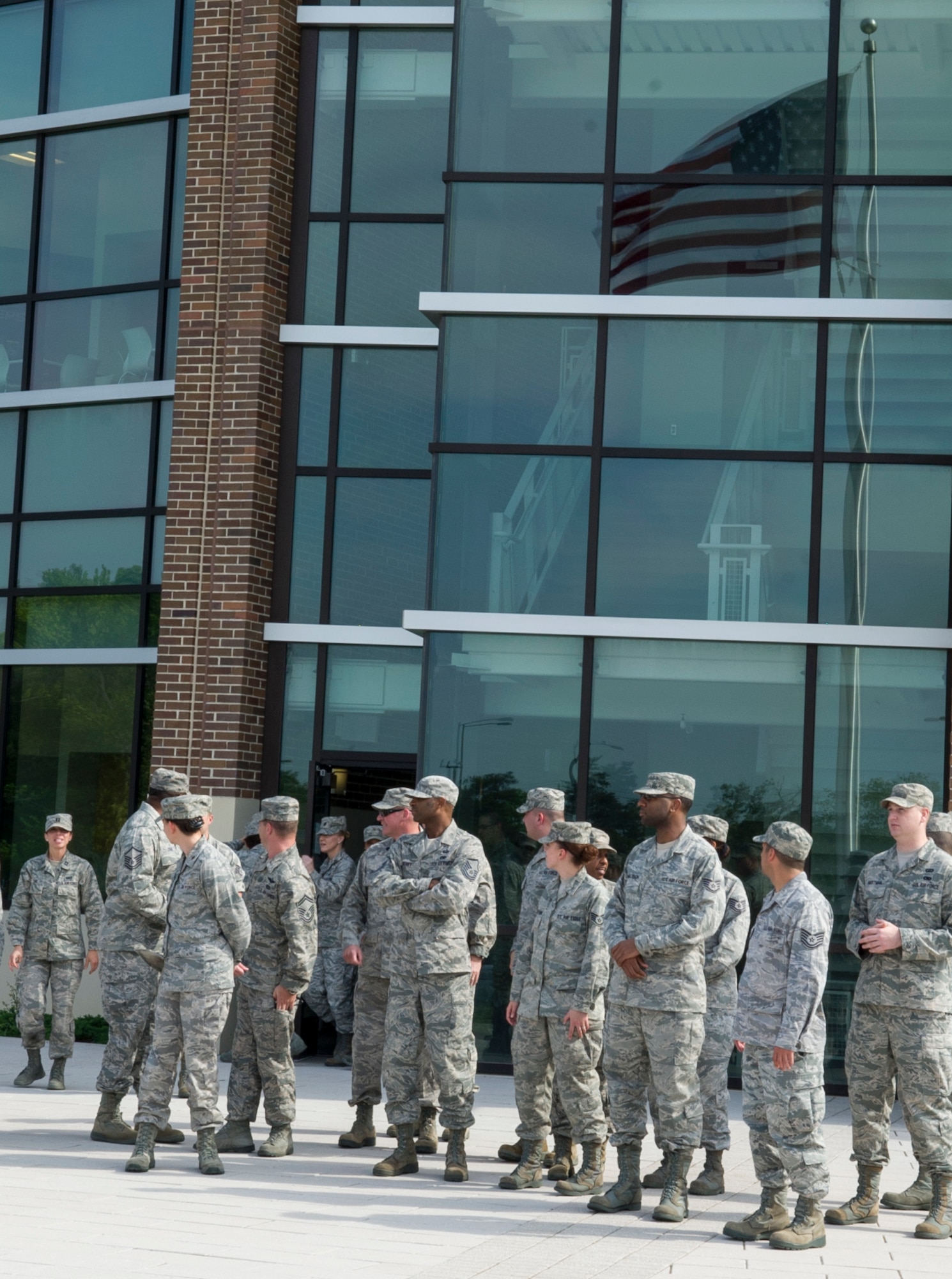 Headquarters Air Force District of Washington Airmen prepare for AFDW’s first retreat ceremony at the Jones Building May 16, 2013 on Joint Base Andrews, Md. AFDW is a direct reporting unit to Headquarters Air Force, reporting to the Chief of Staff of the Air Force. (U.S. Air Force photo by Senior Airman Tabitha N. Haynes)