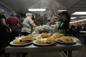 Team Andrews volunteers prepare meals for guests at So Others May Eat in Washington D.C. on May 21, 2013. Service members can find out how to give back to the local community with S.O.M.E. by contacting Chapel One at 301-981-2111. (U.S. Air Force photo/Airman 1st Class Joshua R. M. Dewberry)
