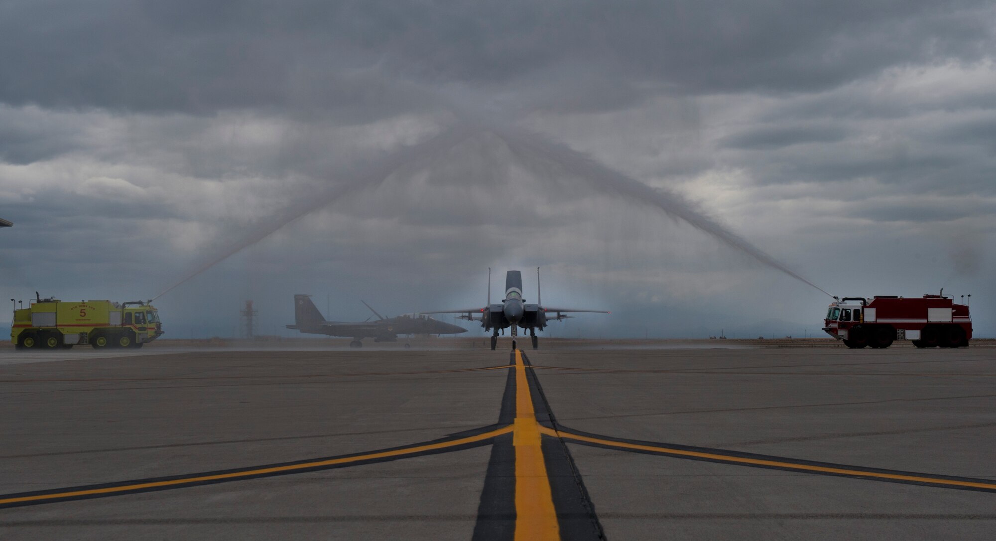 An F-15SG fighter jet piloted by a Republic of Singapore Air Force Airman goes through an archway of water, May 16, 2013 at Mountain Home Air Force Base, Idaho. The RSAF is a tenant unit here for training and is expected to have a detachment here for the next 21 years. (U.S. Air Force Senior Airman Heather Hayward/Released)