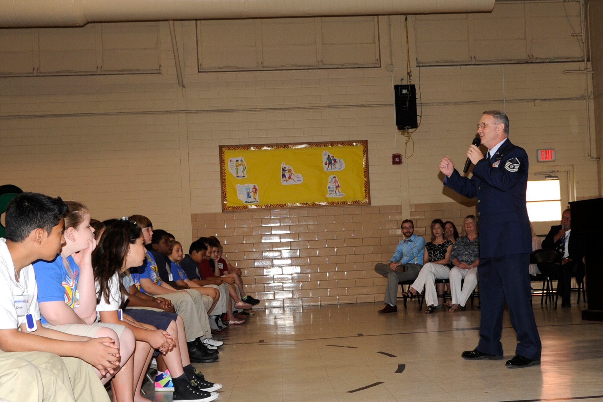 Master Sgt. Jeff Walston, a public affairs technician assigned the 307th Bomb Wing, Barksdale Air Force Base, La., speaks to a group of 5th graders and their parents at Curtis Elementary school in Bossier City, La., May 22, 2013. Walston was the guest speaker for a graduation ceremony at the school.  The students completed an exciting 25-hour hands on/minds on aviation and aerospace course offered to area 5th grade students and their teachers by STARBASE Louisiana, at Barksdale. The program is one of 70 national STARBASE sites, and is sponsored by the 307th BW of the Air Force Reserve Command. Many U.S. Air Force servicemembers volunteer to speak at the graduation ceremonies to help motivate the students to continue their education. This was Walston’s fifth graduation ceremony. Speakers are always welcomed and always needed. Any officer or senior non-commissioned officer interested in motivating these young people should contact the 307th Bomb Wing Public Affairs Office at 318-529-3023 to be put on the speaker’s list. (Courtesy photo by Eva Klimentova)