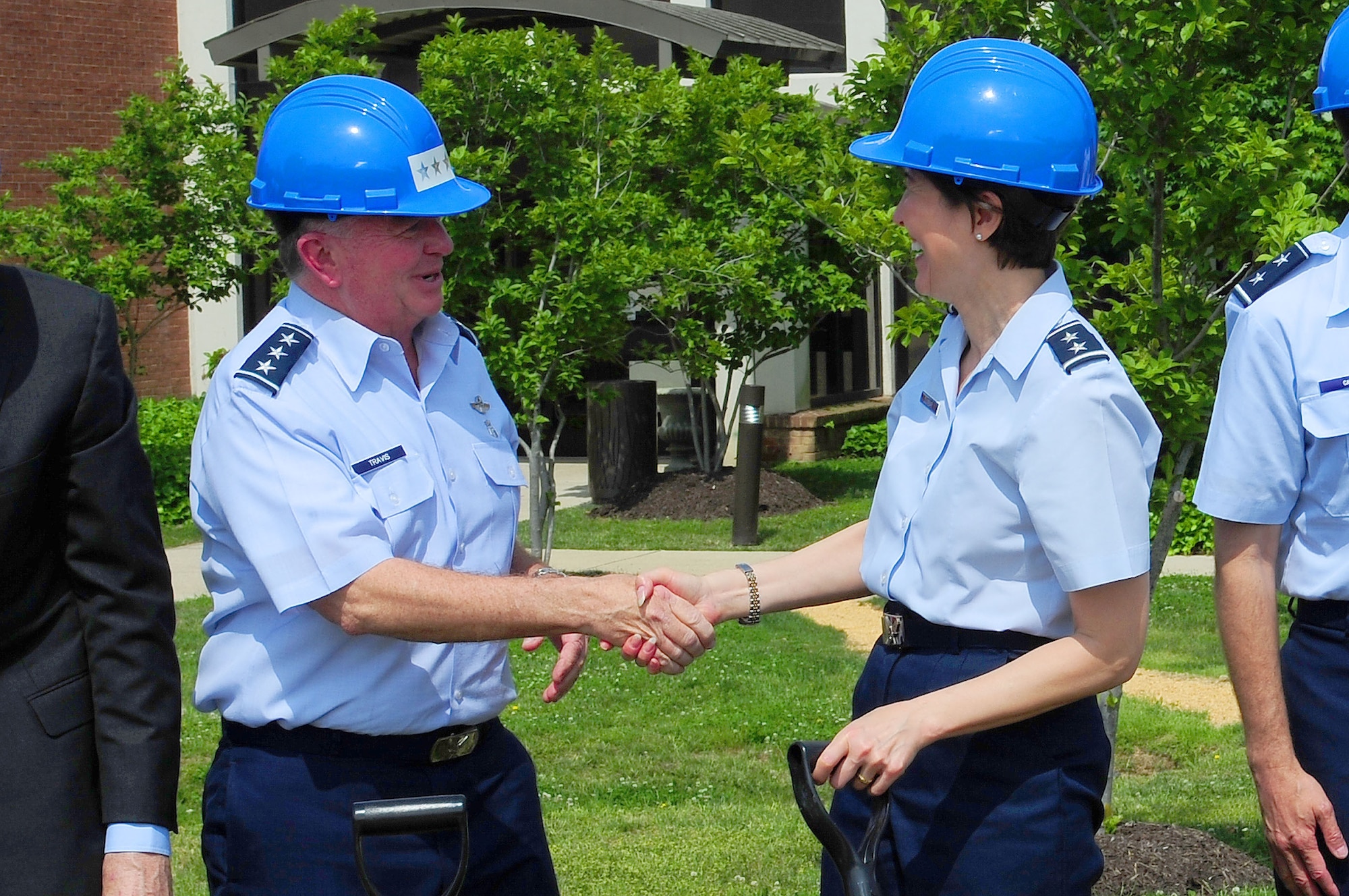 Surgeon General of the Air Force Lt. Gen. (Dr.) Thomas W. Travis greets Air Force District of Washington Commander Maj. Gen. Sharon K. G. Dunbar during a groundbreaking ceremony for the 79th Medical Wing?s new Malcolm Grow Medical Clinic and Surgery Center and the Joint Base Andrews Dental Clinic, May 22, 2013, at JBA, Md. The MGMCSC and JBA Dental Clinic will play a significant role within the National Capital Region by providing world-class medical services to the nation's wounded warriors and the area's service members, retirees and their families. The 79th MDW is one of two wings under AFDW. (U.S. Air Force photo by Senior Airman Steele C. G. Britton)