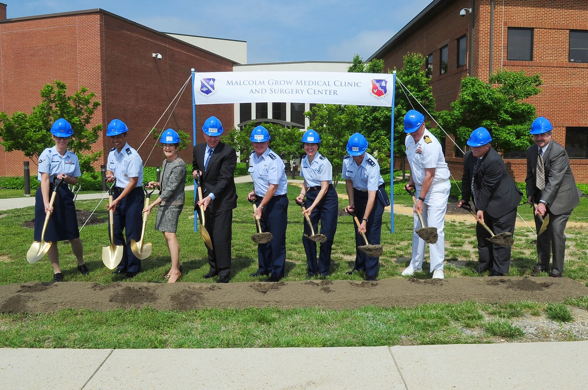 Leadership from across the National Capital Region break ground together for the 79th Medical Wing?s new Malcolm Grow Medical Clinic and Surgery Center and the Joint Base Andrews Dental Clinic, May 22, 2013, at JBA, Md. The eco-friendly certified ?green? multi-story building will encompass more than 300,000 square feet and will be home to an ambulatory care and surgery center, emergent care center, physical and occupational therapy, family health facilities and space for specialty clinics and other ancillary services. (U.S. Air Force photo by Senior Airman Steele C. G. Britton)  