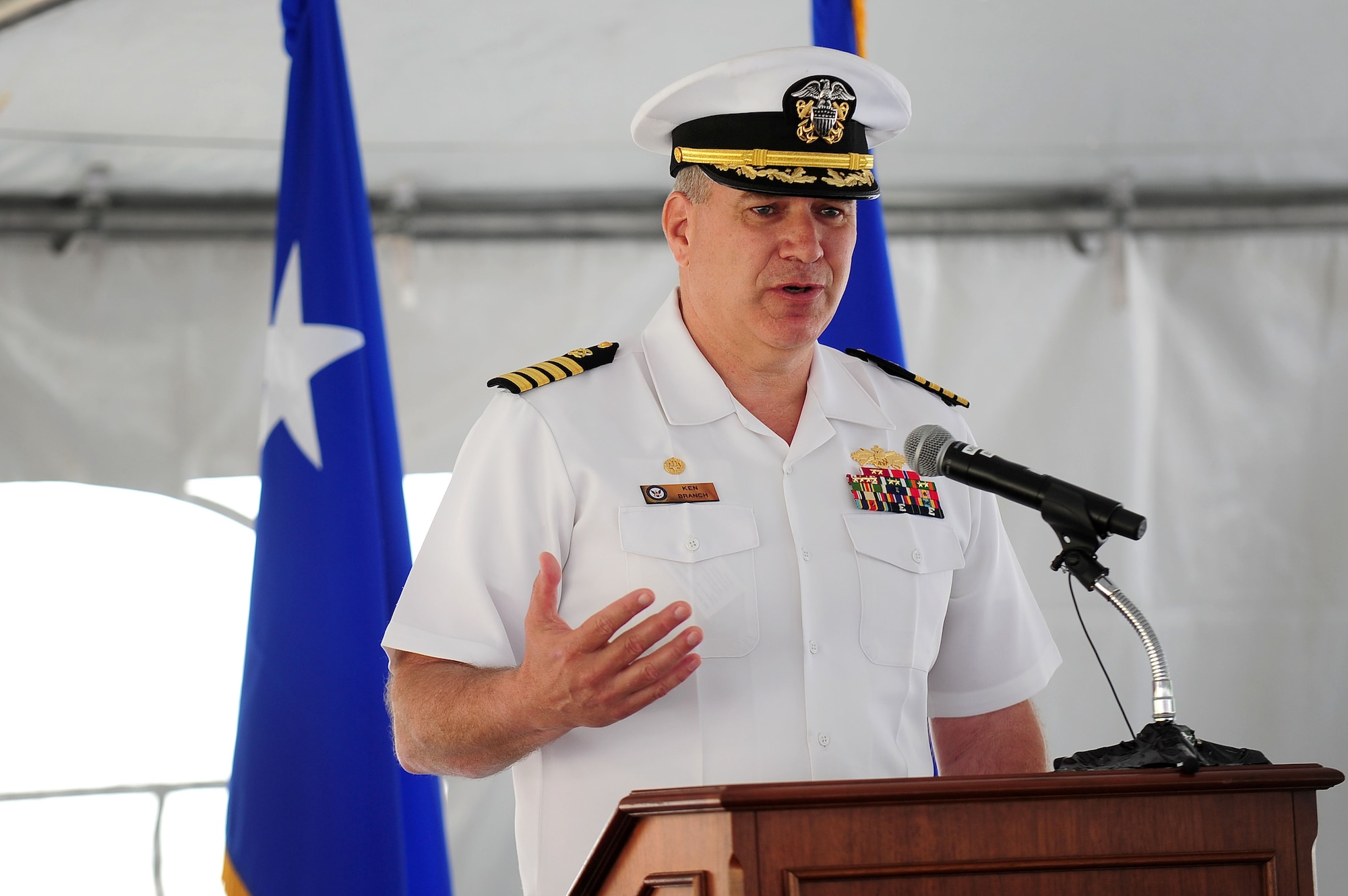 U.S. Navy Capt Kenneth Branch, Naval Facilities Engineering Command Commanding officer speaks to those in attendance of a groundbreaking ceremony for the 79th Medical Wing?s new Malcolm Grow Medical Clinic and Surgery Center and the Joint Base Andrews Dental Clinic, May 22, 2013, at JBA, Md. Branch, who is the lead officer for the MGMCSC building contract, shared his personal tie and positive experience at the clinic when his wife gave birth to their daughter more than twenty years ago at the facility that stands on JBA today. (U.S. Air Force photo by Senior Airman Steele C. G. Britton)