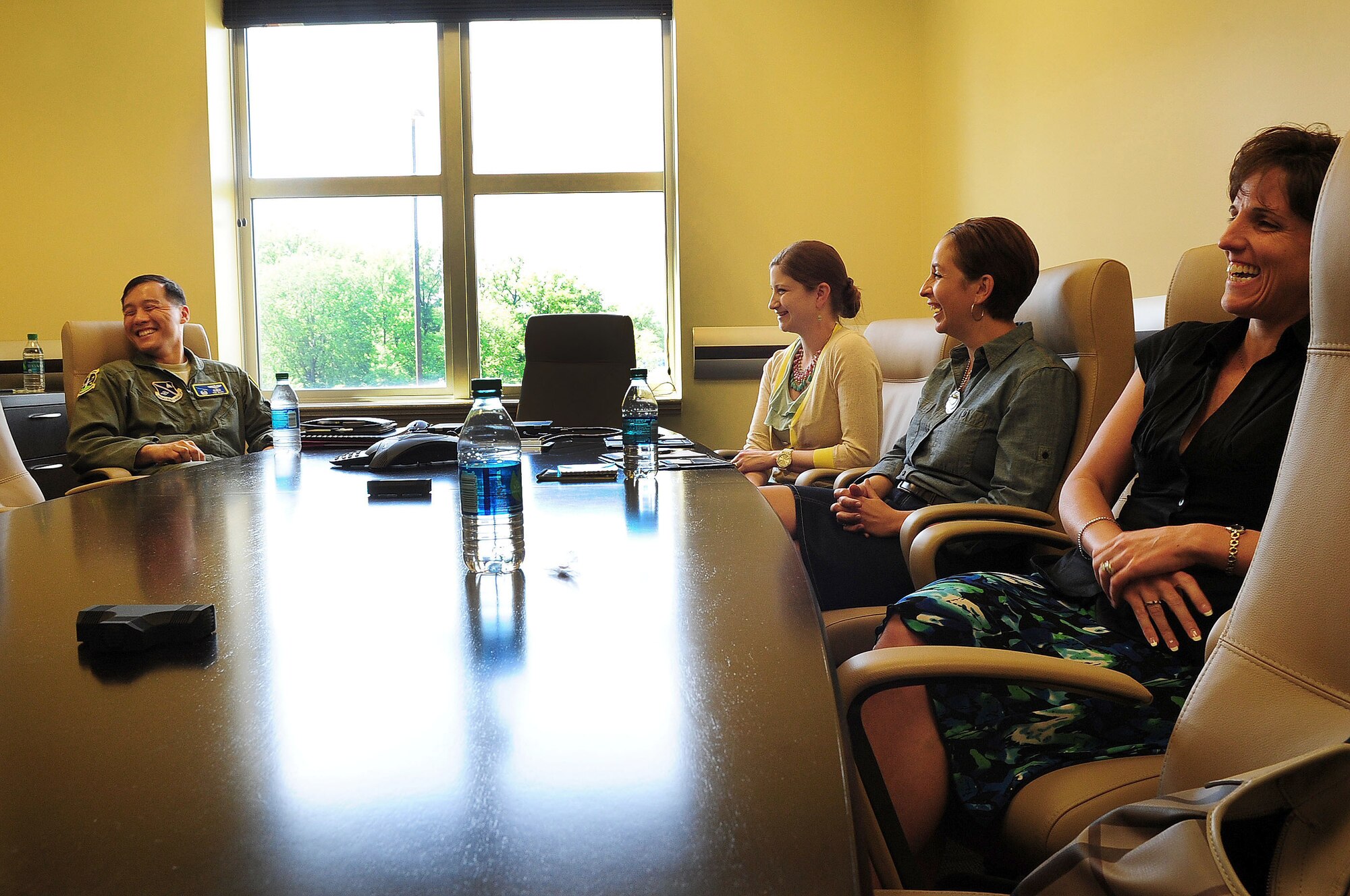 Lt. Col. Timothy Buck, 1st Helicopter Squadron commander, and fellow Joint Base Andrews leaders spend time with spouses of incoming JBA commanders during the Air Force District of Washington Commanders Course May 15, 2013 at JBA, Md. Spouses spent time during the three-day event getting to know the Air Force mission within the National Capital Region and throughout the world. (U.S. Air Force photo by Senior Airman Steele C. G. Britton)