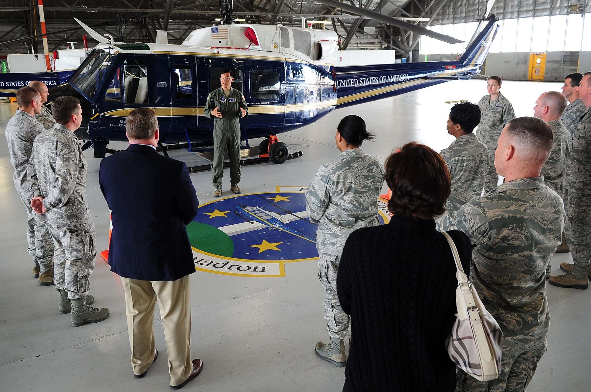 Lt. Col. Timothy Buck, 1st Helicopter Squadron commander, describes the mission of his unit to Joint Base Andrews incoming commanders during the Air Force District of Washington Commanders Course May 15, 2013, at JBA, Md. The three-day course offered the commanders and their spouses a first-hand look at JBA and its missions across the National Capital Region and throughout the world.  (U.S. Air Force photo by Senior Airman Steele C. G. Britton)