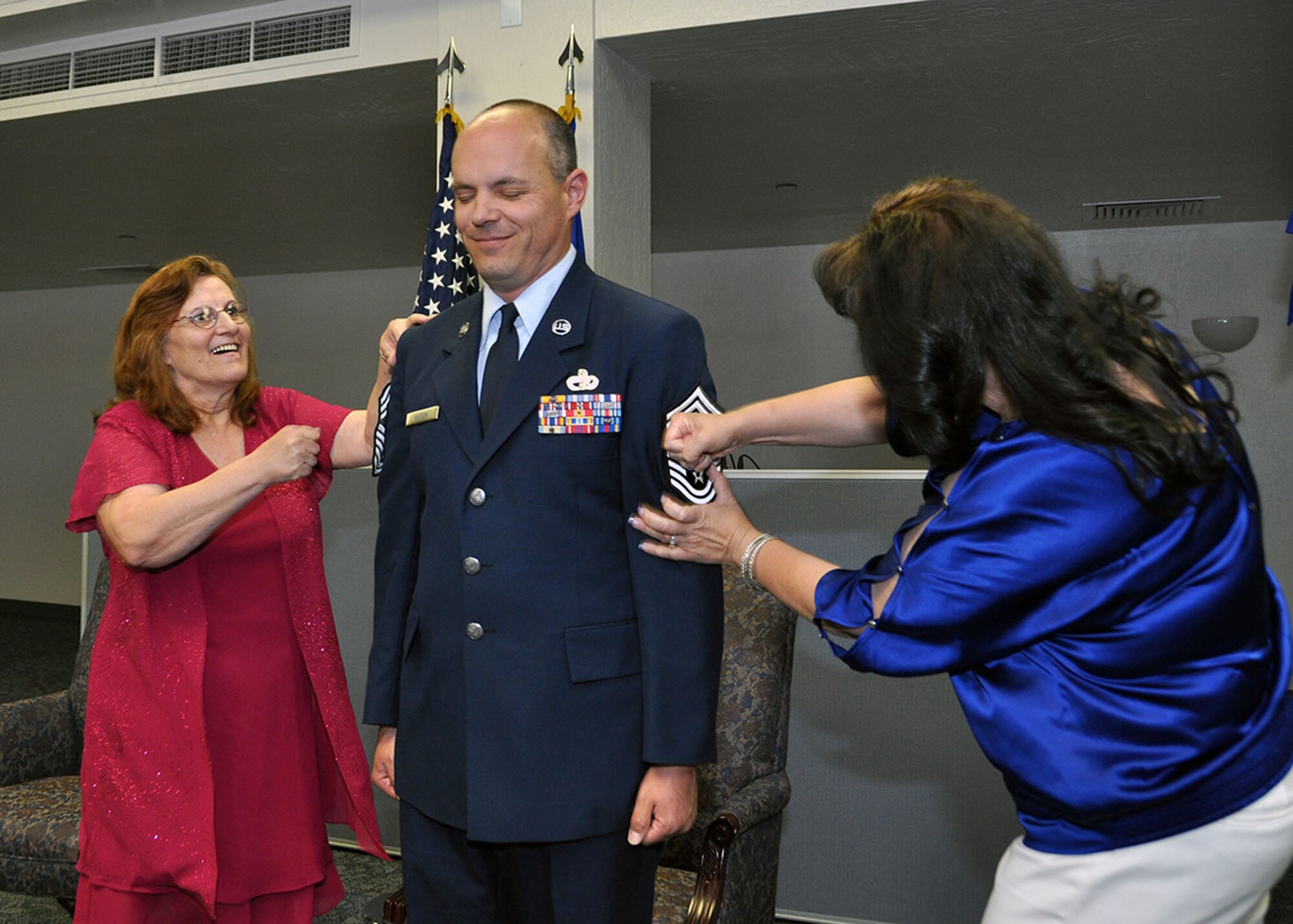 TRAVIS AIR FORCE BASE, Calif. -- Chief Master Sgt. Jayson Waton, 82nd Aerial Port Squadron operations superintendent, officially “pinned-on” his new rank in a ceremony held at the passenger terminal, Travis Air Force Base, Calif. (U.S. Air Force photo / Senior Master Sgt. Robert Wade) 