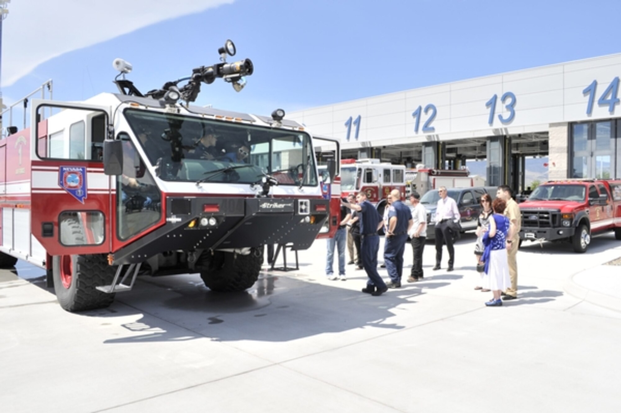 Representatives from various organizations view firefighting equipment at the Nevada Air Guard base in Reno on May 15 during the 2013 Nevada ESGR Employer Recognition Event. The event recognized the extraordinary reserve-component military support of more than 40 Nevada public and private organizations.  NV ANG Photo by Senior Airman Ashif Halim (released).