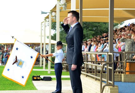 Under secretary of the Air Force Eric Fanning salutes during the playing of the National Anthem at an Air Force Basic Military Training graduation May 17, 2013, at Joint Base San Antonio-Lackland. Fanning visited with members of Joint Base San Antonio May 16 and 17 with stops at Randolph, Lackland, and Fort Sam Houston as part of his first base visit as under secretary. (U.S. Air Force photo/Benjamin Faske) 