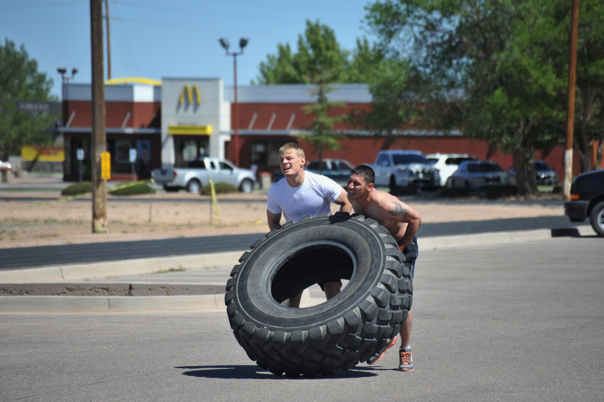 Tire flipping was one of the events at the 21st Ordnance Company Challenge, a three-day team competition at Kirtland testing physical and mental fitness. (Photo by Ken Moore)
