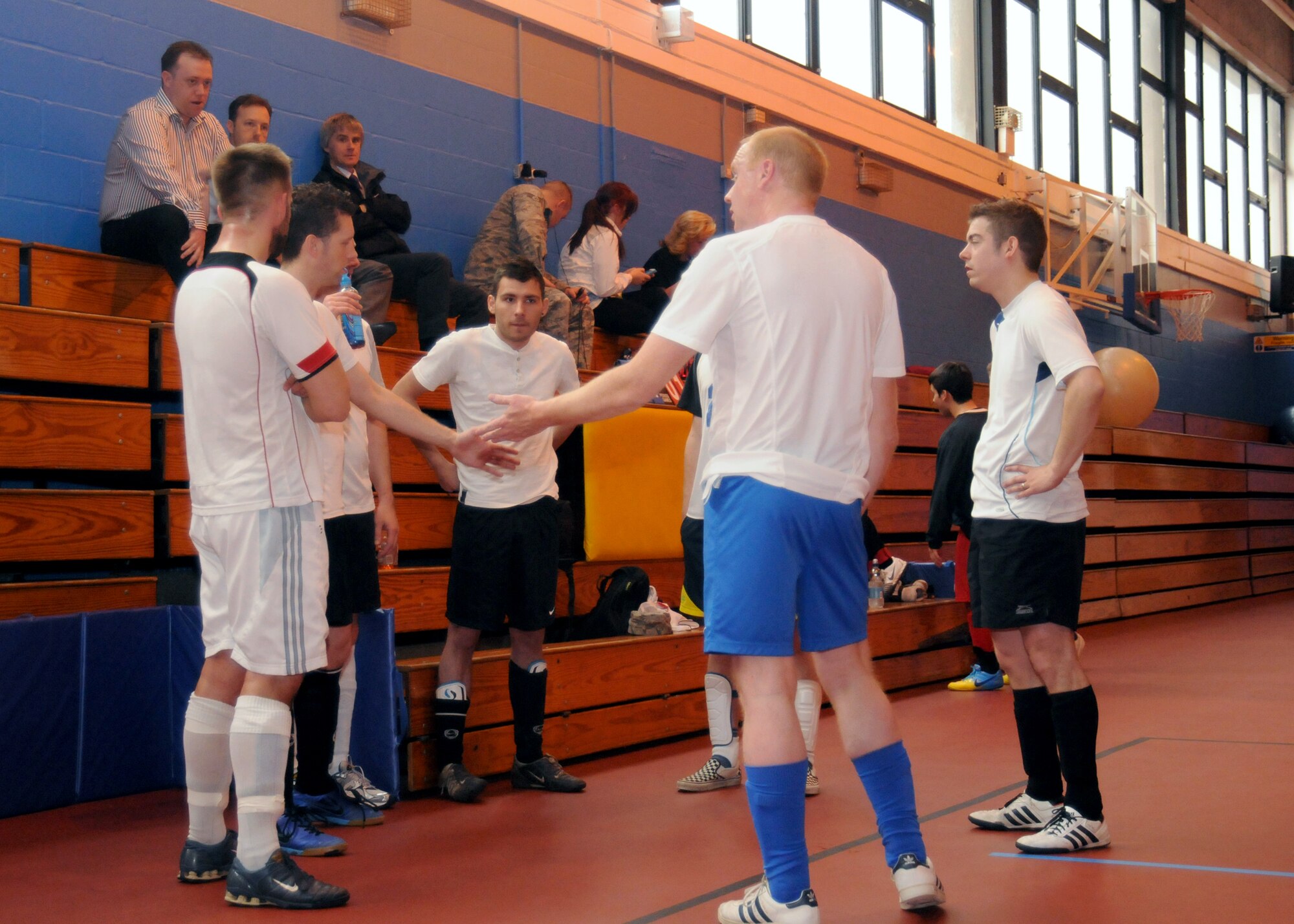 Members of the 100th Civil Engineer Squadron team strategize during half time of an extramural soccer championship game May 23, 2013, at RAF Mildenhall, England. The 100th CES beat the 100th MXG five to one to retain their title. (U.S. Air Force photo by Tech. Sgt. Neal X. Joiner/Released) 