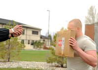 Airman 1st Class Sean Egan, 319th Security Forces Squadron, is sprayed with oleoresin capsicum, or pepper spray, during non-lethal weapons training on May 21, 2013, on Grand Forks Air Force Base, N.D. The training required Airmen to be sprayed and fight off opponents while performing riot baton techniques for 30 seconds in three different obstacles. (U.S. Air Force photo/Airman 1st Class Xavier Navarro)  