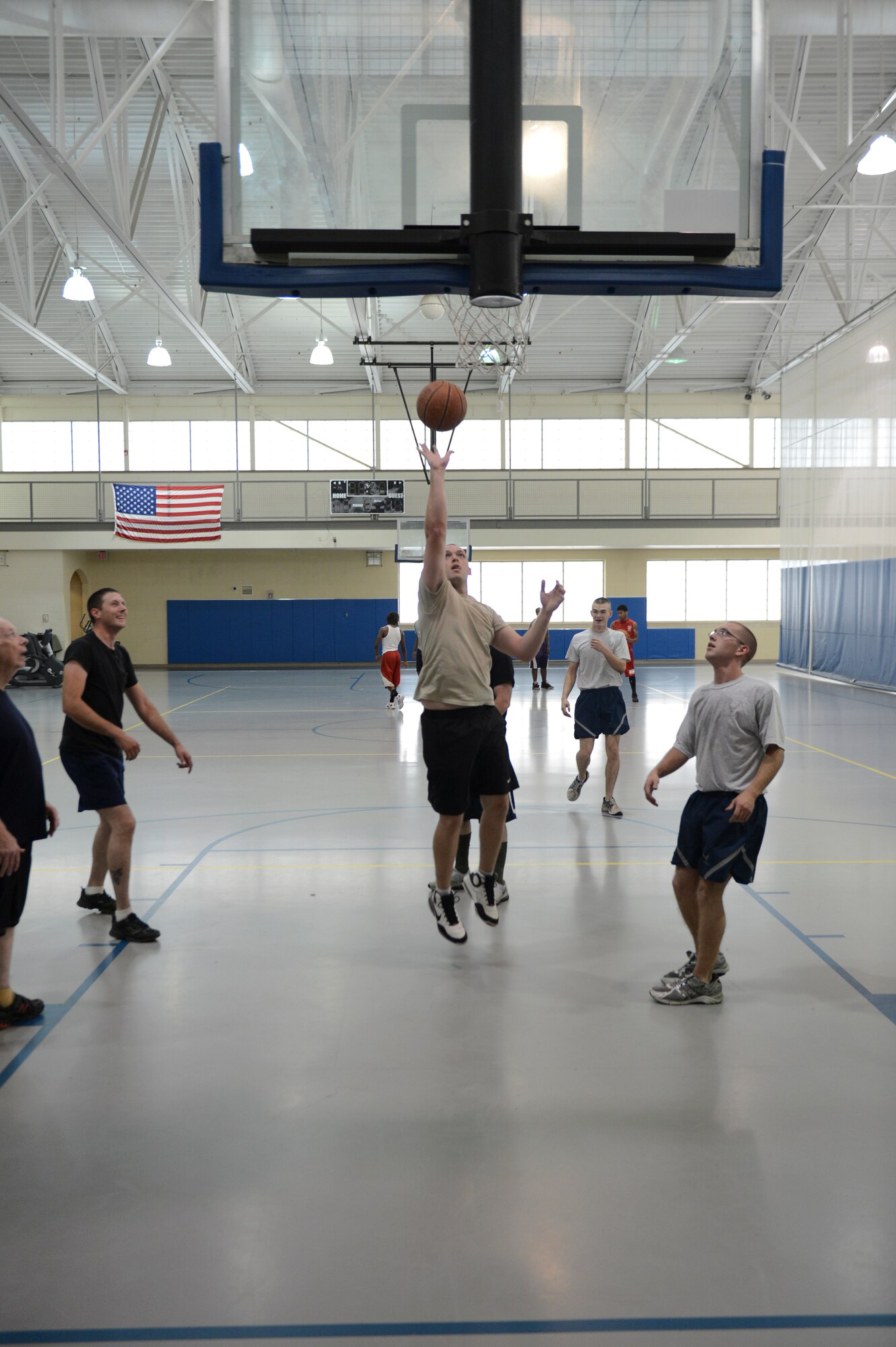 Patrons of the Senior Airman Bryan Bell Fitness Center play basketball on Barksdale Air Force Base, La., May 22, 2013. The fitness center is open from 4 a.m. to midnight on weekdays and 8 a.m. to 6 p.m. on weekends. (U.S. Air Force photo/Senior Airman Micaiah Anthony